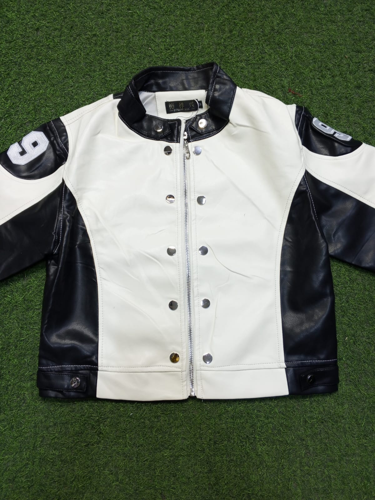 The interior is lined with a smooth Polyester or Viscose blend fabric to allow for easy layering and comfortable wear.