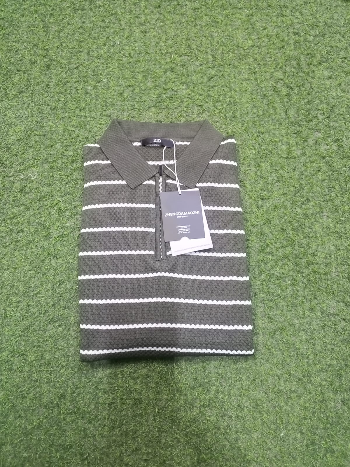 Muted olive green (army green) base color accented with thin, crisp white horizontal stripes.